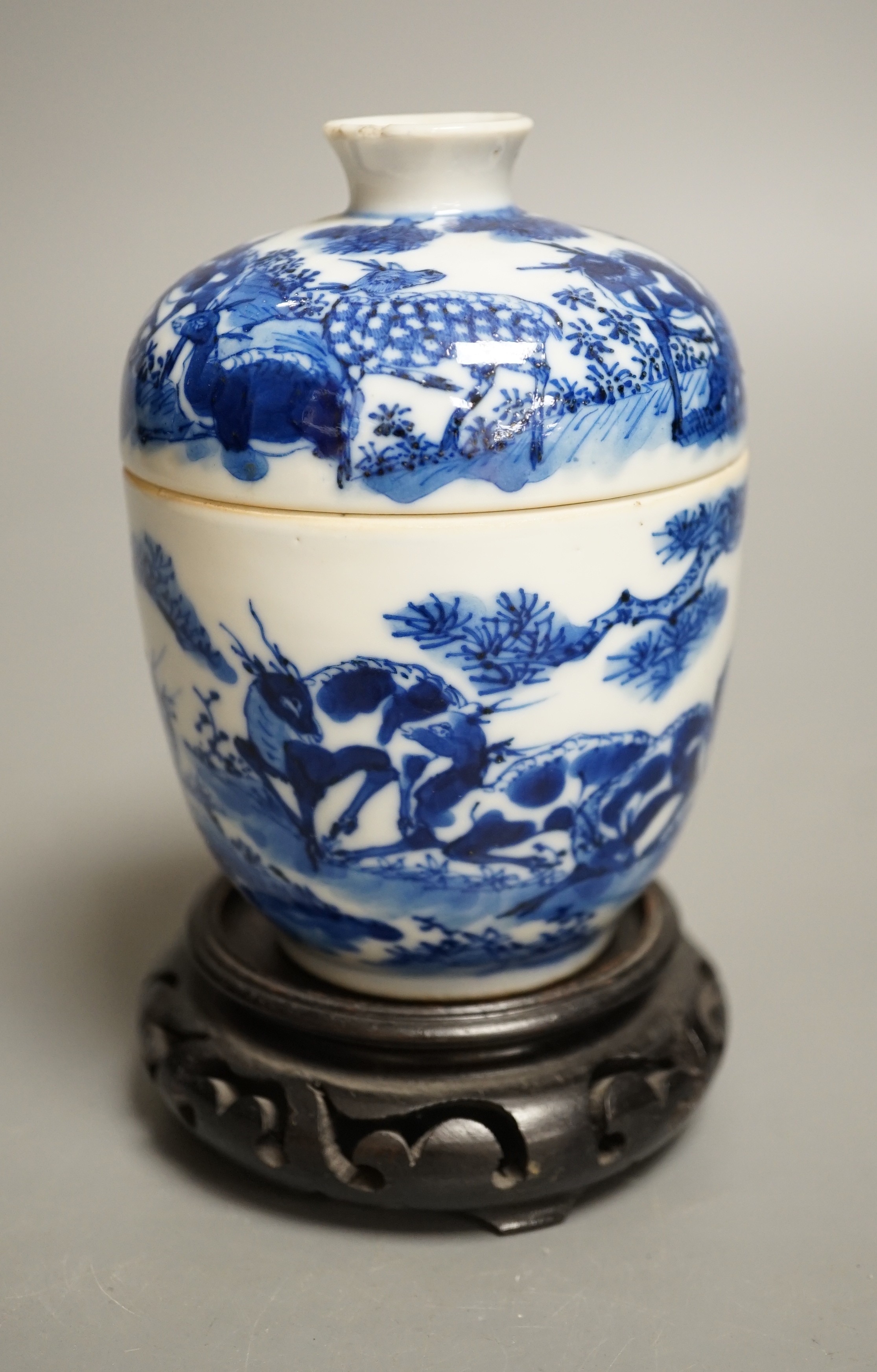 A 19th century Chinese blue and white ‘eight deer’ bowl and cover, ‘man tang fu ji’ mark, 12cm excluding wood stand